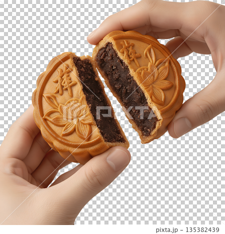 Hand holding and splitting open traditional mooncake to reveal the sweet paste filling, perfect for mid-autumn festival and asian culture Hand holding and splitting open traditional mooncake to reveal the sweet paste filling, perfect for mid-autumn festival and asian culture 135382439