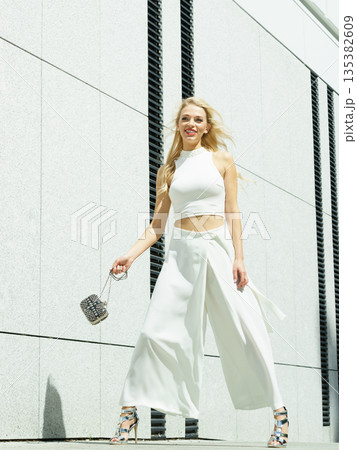 Playful woman wearing crop top and culottes 135382609
