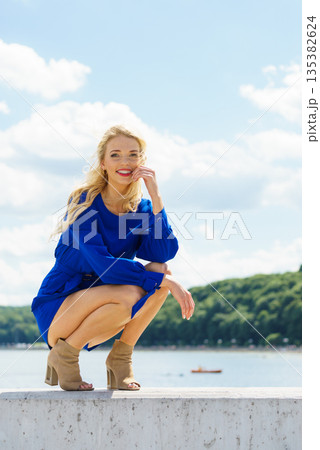 Fashion model wearing blue jumpsuit 135382624