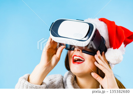 Girl watching 3d film tour in virtual reality glasses. Girl watching 3d film tour in virtual reality glasses. 135382680