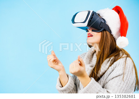 Girl watching 3d film tour in virtual reality glasses. 135382681