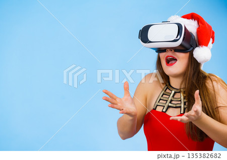 Girl watching 3d film tour in virtual reality glasses. Girl watching 3d film tour in virtual reality glasses. 135382682
