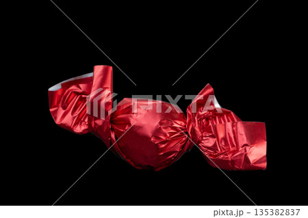 chocolate candies in red wrappers chocolate candies in red wrappers 135382837