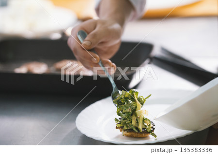 Chef serves dish on the plate in restaurant Chef serves dish on the plate in restaurant 135383336