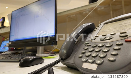 Office Desk with Telephone and Computer Monitor Office Desk with Telephone and Computer Monitor 135387899