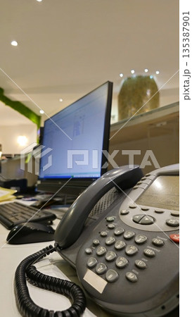 Office Desk Setup with Telephone and Computer Monitor Office Desk Setup with Telephone and Computer Monitor 135387901