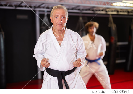 Senior martial artist training kata for healthy aging Senior martial artist training kata for healthy aging 135389566