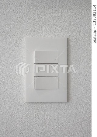 Close-up of a white wall and switch 135392114