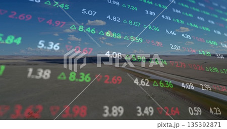 Floating multi-colored stock market figures drifting across dry plain, with steel pipeline Floating multi-colored stock market figures drifting across dry plain, with steel pipeline 135392871
