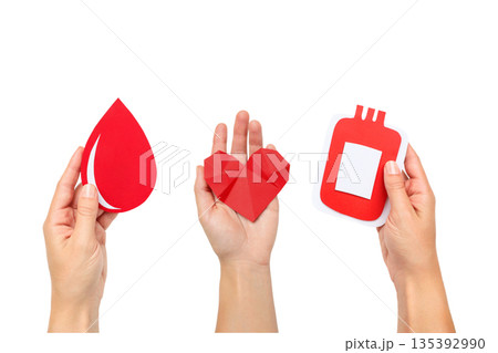 Hands hold red paper cutouts: droplet, heart, bag, isolated, PNG 135392990