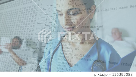 Indian female nurse in blue scrubs holding stethoscope between hospital beds, with network overlay Indian female nurse in blue scrubs holding stethoscope between hospital beds, with network overlay 135393088