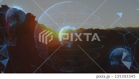 Floating three wireframe globes glowing with blue dots above mountain ridge at sunset, with nodes Floating three wireframe globes glowing with blue dots above mountain ridge at sunset, with nodes 135393345
