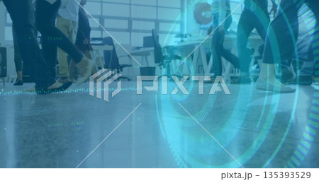 Moving workers' legs crossing open-plan office, with furniture, grid-style windows and blue overlay 135393529