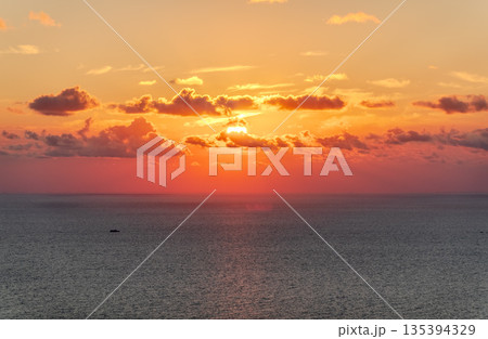 Beautiful red and orange sunrise over the sea. 135394329