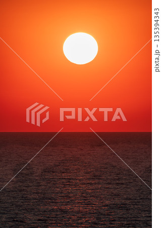 Beautiful red and orange sunrise over the sea. Beautiful red and orange sunrise over the sea. 135394343