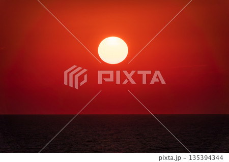 Beautiful red and orange sunrise over the sea. 135394344