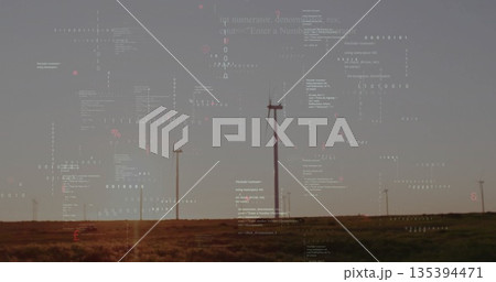 Showing central wind turbine tower rotating its blades on open prairie, with floating code overlays Showing central wind turbine tower rotating its blades on open prairie, with floating code overlays 135394471