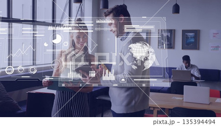 Discussing project two coworkers examining tablet with stylus in modern office, with data overlays Discussing project two coworkers examining tablet with stylus in modern office, with data overlays 135394494