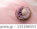 Single Easter Egg in Basket on Pink Background 135396055