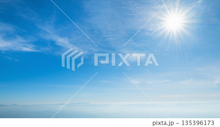 clear blue sky with bright sun shining through the clouds clear blue sky with bright sun shining through the clouds 135396173