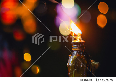 bottle with candle inside of it bottle with candle inside of it 135397070