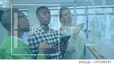 Collaborating male in checkered shirt holding tablet in office, with sticky notes and code overlay Collaborating male in checkered shirt holding tablet in office, with sticky notes and code overlay 135398345