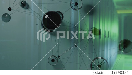 Displaying digital network overlay hovering in server room, with glossy spheres and green LEDs Displaying digital network overlay hovering in server room, with glossy spheres and green LEDs 135398384