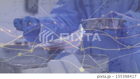 Arranging worker wearing scrubs loading bowls onto wire rack in sterile area with network overlay Arranging worker wearing scrubs loading bowls onto wire rack in sterile area with network overlay 135398417