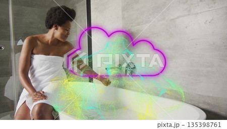 Towel-wrapped woman touching tub faucet in bathroom, with neon cloud, green point-cloud, copy space 135398761