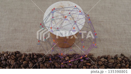Sitting takeaway coffee cup with foam, network overlay on cafe table, beans and cinnamon sprinkles 135398801