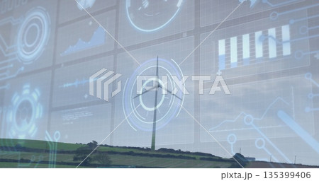 Spinning tall white wind turbine on green hedged hillside, with translucent panels showing charts 135399406