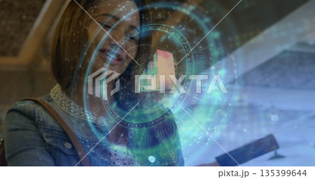 Woman wearing denim jacket and white lace top exploring AR interface above smartphone in demo area Woman wearing denim jacket and white lace top exploring AR interface above smartphone in demo area 135399644