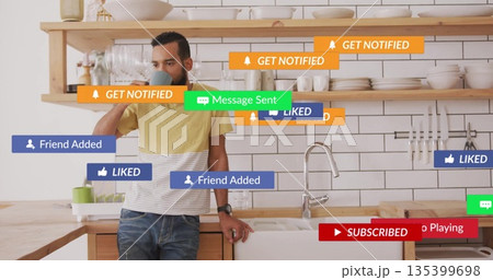 Leaning man holding smartphone to ear in home kitchen, with digital notification overlays Leaning man holding smartphone to ear in home kitchen, with digital notification overlays 135399698