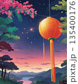 A vibrant lantern glowing over a serene sunset landscape, creating a mesmerizing scene 135400176