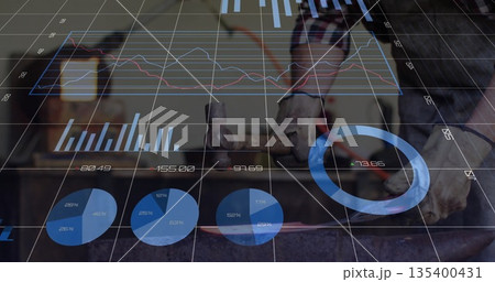 Hammering metalworker forging red-hot workpiece at workshop anvil, with digital data overlays 135400431