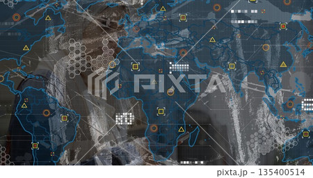 Businesswoman operating digital dashboard in high-tech room, with world map grid and data markers 135400514