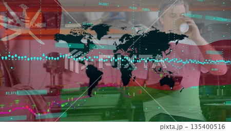 Drinking adult man sipping coffee mug, viewing Oman flag and market graphs in kitchen, copy space 135400516