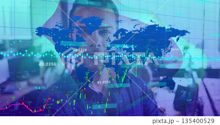 Clutching man in business shirt holding head in open-plan office, with floating map and charts 135400529