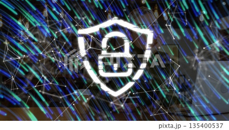 Shining padlock icon within shield outline hovering in network mesh with teal blue light trails 135400537