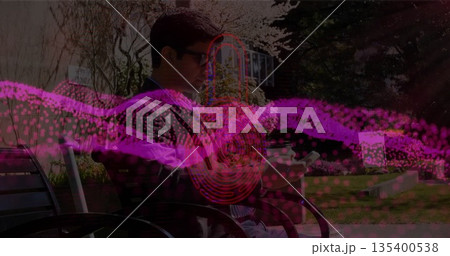 Blazer-clad man sitting on metal bench on park lawn checking smartphone, with digital wave Blazer-clad man sitting on metal bench on park lawn checking smartphone, with digital wave 135400538