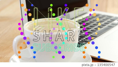 White cup holding coffee on saucer beside laptop at desk, LIKE SHARE SUBSCRIBE confetti, copy space 135400547