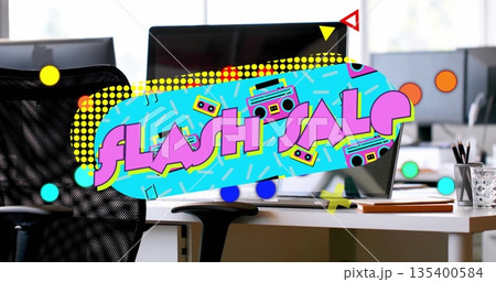 Displaying vibrant flash sale graphic in open-plan office, with computer monitors and chair 135400584
