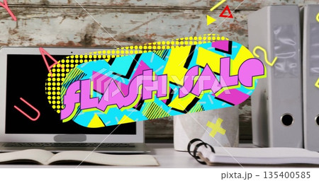Displaying FLASH SALE graphic overlay over wooden desk area, featuring laptop and notebook 135400585