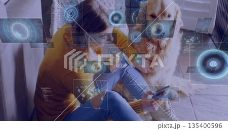 Woman wearing mustard sweater petting golden retriever at home, with AR overlays, copy space 135400596