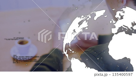 Developer forearms using touchscreen device in workspace with coffee cup, code and globe overlay Developer forearms using touchscreen device in workspace with coffee cup, code and globe overlay 135400597