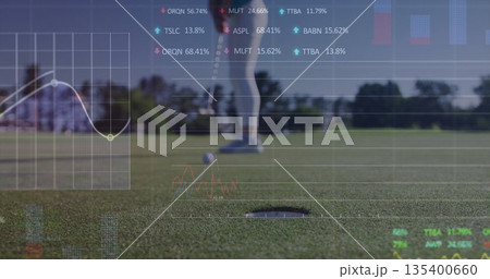 Lining up golfer in sportswear putting ball toward hole on green, with translucent financial charts Lining up golfer in sportswear putting ball toward hole on green, with translucent financial charts 135400660