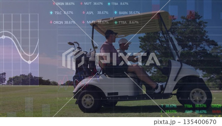 Riding golf partners cruising cart on fairway in polos and caps, with club bags, digital charts Riding golf partners cruising cart on fairway in polos and caps, with club bags, digital charts 135400670