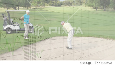 Swinging senior golfer hitting ball from sand bunker at golf course, with club, cart, copy space 135400698