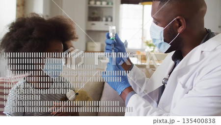 Preparing male doctor drawing vial into syringe in home living room, with teddy bear, copy space 135400838