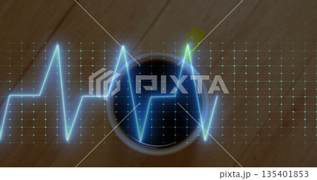Featuring white coffee mug resting on cafe tabletop, with glowing blue digital grid, ECG waveform 135401853
